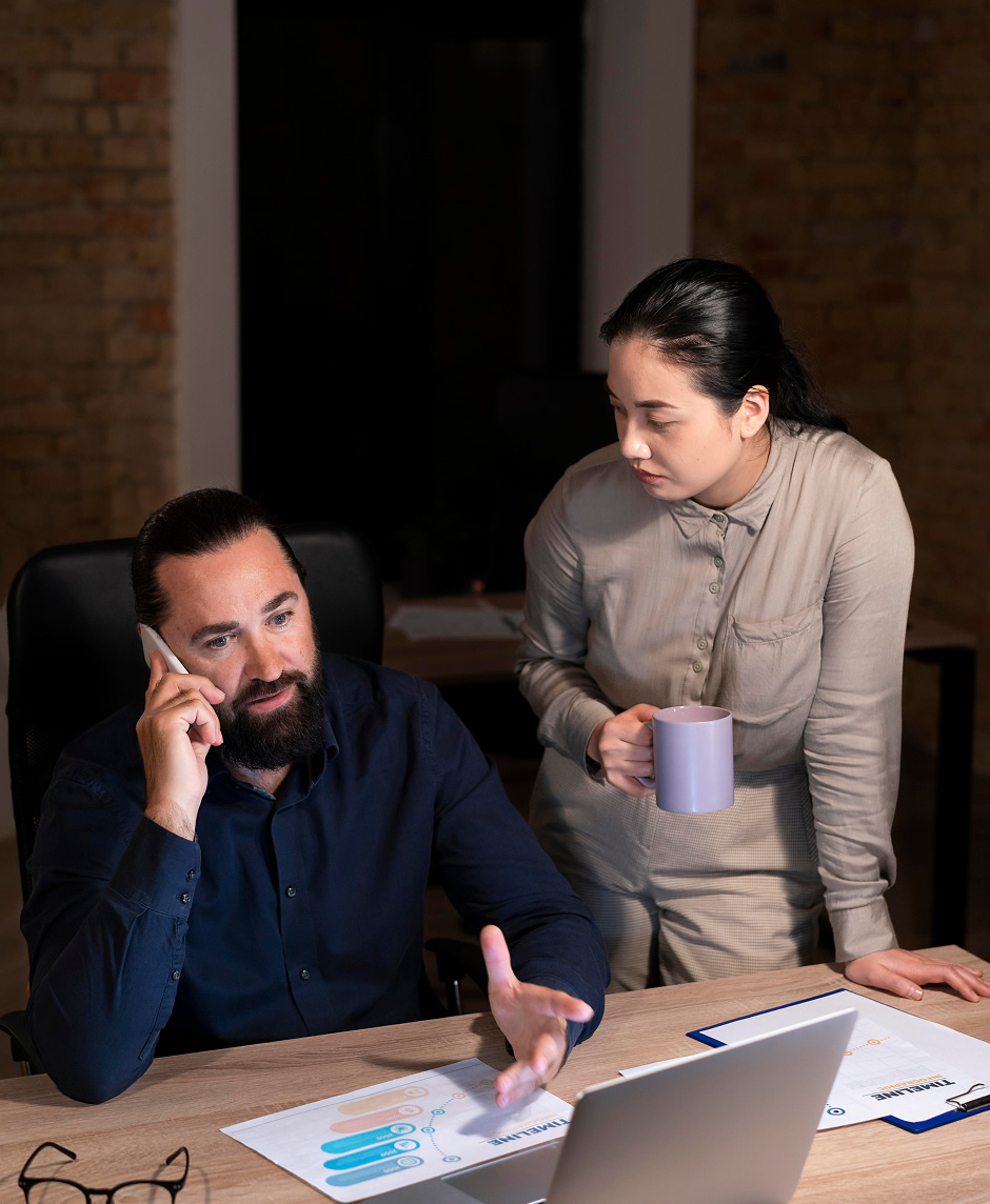 Tired people working late at their office