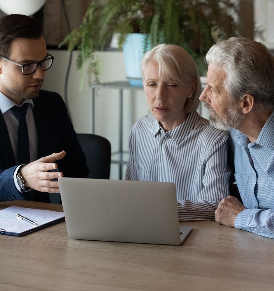 Older clients consulting agent broker about house selling medical insurance terms trust fund investment meeting at laptop in office senior couple discussing wills with lawyer solicitor notary